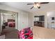 Spacious bedroom with mirrored closet doors and a ceiling fan at 2333 E Southern Ave # 2041, Tempe, AZ 85282