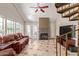 Living room with spiral staircase, fireplace, and tiled floors at 2333 E Southern Ave # 2041, Tempe, AZ 85282