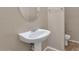 Powder room with pedestal sink and toilet at 2542 W Kit Carson Trl, Phoenix, AZ 85086