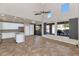 Modern kitchen with white cabinets, island, and access to backyard at 2542 W Kit Carson Trl, Phoenix, AZ 85086