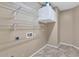 Laundry room with wire shelving and overhead cabinets at 2542 W Kit Carson Trl, Phoenix, AZ 85086