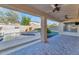 Covered patio with brick pavers and ceiling fans at 2542 W Kit Carson Trl, Phoenix, AZ 85086