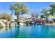 Landscaped pond with waterfall feature near playground at 2542 W Kit Carson Trl, Phoenix, AZ 85086