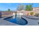 Relaxing kidney shaped pool with a waterfall feature at 2542 W Kit Carson Trl, Phoenix, AZ 85086