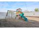 Swing set and playset in the backyard at 29362 W Weldon Ave, Buckeye, AZ 85396