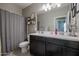 Bathroom with double vanity and large mirror at 29362 W Weldon Ave, Buckeye, AZ 85396