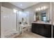 Bathroom with double vanity and large mirror at 29362 W Weldon Ave, Buckeye, AZ 85396