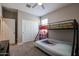 Spacious bedroom with bunk beds and double door closet at 29362 W Weldon Ave, Buckeye, AZ 85396