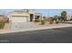 House exterior showcasing a front yard with landscaping and a driveway at 29362 W Weldon Ave, Buckeye, AZ 85396