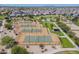 Aerial view of tennis courts near community pool and playground at 29362 W Weldon Ave, Buckeye, AZ 85396