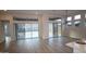 Bright living room with floor-to-ceiling windows, tile floors, and access to the outdoor patio at 32496 N 135Th Dr, Peoria, AZ 85383