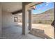 Covered patio supported by large columns with hillside view at 32496 N 135Th Dr, Peoria, AZ 85383