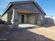 Covered patio with stone pillars and a view of the backyard at 33364 N 132Nd Dr, Peoria, AZ 85383