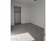 Spacious bedroom with gray carpet and large closet at 33364 N 132Nd Dr, Peoria, AZ 85383