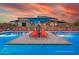 Resort-style pool with lounge chairs and shade structures at 33364 N 132Nd Dr, Peoria, AZ 85383