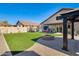 Landscaped backyard featuring a fire pit and plenty of green space at 3610 N 106Th Ave, Avondale, AZ 85392