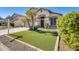 Two-story house with a two-car garage and artificial turf at 3610 N 106Th Ave, Avondale, AZ 85392