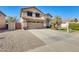 Two-story house with a two-car garage and landscaped front yard at 3610 N 106Th Ave, Avondale, AZ 85392