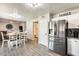 Modern kitchen with stainless steel appliances and white cabinets, near dining and bathroom at 3610 N 106Th Ave, Avondale, AZ 85392