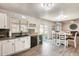 White kitchen cabinets, stainless steel appliances and an adjacent dining area at 3610 N 106Th Ave, Avondale, AZ 85392