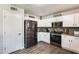 Modern kitchen with white cabinets, stainless steel appliances, and ample counter space at 3610 N 106Th Ave, Avondale, AZ 85392