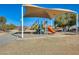 Shaded playground with climbing structures and slide at 3610 N 106Th Ave, Avondale, AZ 85392