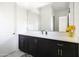 Clean bathroom with a modern vanity and large mirror at 3928 E Crittenden Ln, Phoenix, AZ 85018