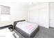 Spacious bedroom with a queen bed and large closet at 3928 E Crittenden Ln, Phoenix, AZ 85018