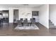 Elegant dining room with a large table, gray chairs, and hardwood floors at 3928 E Crittenden Ln, Phoenix, AZ 85018