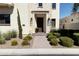 Elegant home entry with a stone facade and landscaping at 3928 E Crittenden Ln, Phoenix, AZ 85018