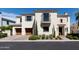 Two-story home with stone accents, shutters, and a two-car garage at 3928 E Crittenden Ln, Phoenix, AZ 85018