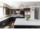 Modern kitchen with white countertops and dark cabinets at 3928 E Crittenden Ln, Phoenix, AZ 85018