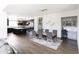 Open concept kitchen and dining area with island, modern cabinetry, and hardwood floors at 3928 E Crittenden Ln, Phoenix, AZ 85018