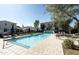 Inviting community pool with lounge chairs and patio tables at 3928 E Crittenden Ln, Phoenix, AZ 85018