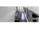 View of a modern upper hallway with dark wood floors and iron railings at 3928 E Crittenden Ln, Phoenix, AZ 85018