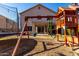 Spacious backyard with playset, trampoline, and patio at 3984 E Los Altos Dr, Gilbert, AZ 85297