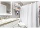 Clean bathroom with granite countertop, white cabinets, and shower/tub combo at 3984 E Los Altos Dr, Gilbert, AZ 85297