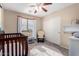 Bright Bedroom with crib, rocker, and closet at 3984 E Los Altos Dr, Gilbert, AZ 85297