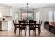 Bright dining area with wooden table and chairs near kitchen and sliding door at 3984 E Los Altos Dr, Gilbert, AZ 85297