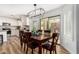 Kitchen dining area with wooden table and chairs, and sliding door to backyard at 3984 E Los Altos Dr, Gilbert, AZ 85297