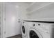 Convenient laundry room with washer, dryer, and shelving at 3984 E Los Altos Dr, Gilbert, AZ 85297