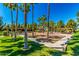 Community playground with play structures, shaded seating, and grassy areas at 3984 E Los Altos Dr, Gilbert, AZ 85297