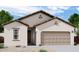 Spanish style home with tan colored exterior and 2 car garage at 4145 E Kolin Ln, San Tan Valley, AZ 85143