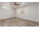 Bright bedroom with wood-look floors and ceiling fan at 4314 E Forest Pleasant Pl, Cave Creek, AZ 85331