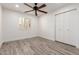 Charming bedroom with wood-look floors and ceiling fan at 4314 E Forest Pleasant Pl, Cave Creek, AZ 85331