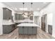 Modern kitchen with gray cabinets, white subway tile backsplash and island at 4314 E Forest Pleasant Pl, Cave Creek, AZ 85331