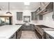 Modern kitchen with gray cabinets, white subway tile backsplash and stainless steel appliances at 4314 E Forest Pleasant Pl, Cave Creek, AZ 85331