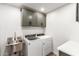 Bright laundry room, featuring modern cabinets and stainless steel sink at 4314 E Forest Pleasant Pl, Cave Creek, AZ 85331