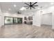 Open floor plan with gray kitchen cabinets and wood-look tile floors at 4314 E Forest Pleasant Pl, Cave Creek, AZ 85331