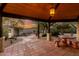 Covered patio with seating area overlooking the tranquil backyard at 4314 E Forest Pleasant Pl, Cave Creek, AZ 85331